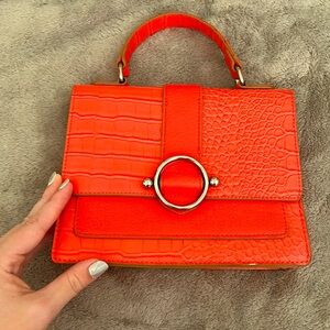 Never worn small purse. Anne Klein coral color.
